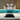 Turquoise gradient glass kitchen splashback with LED lighting, modern wood cabinets and gas hob
