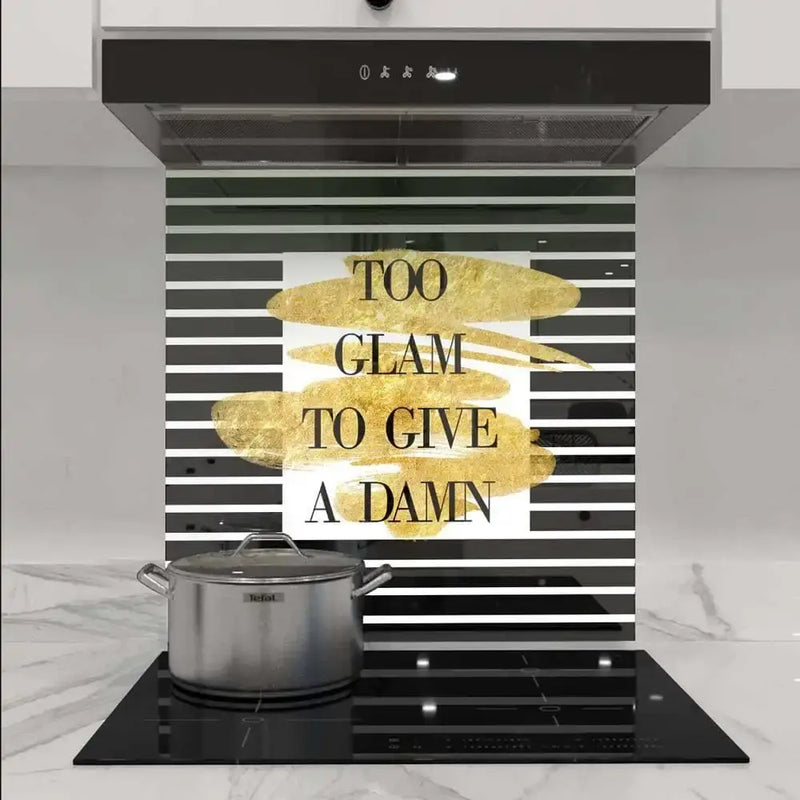 Black and white striped kitchen splashback with gold text 'Too Glam To Give A Damn', modern luxury decor