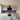 Vibrant purple glass kitchen splashback with modern white cabinets and stainless steel appliances