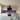 Vibrant purple glass kitchen splashback with modern white cabinets and stainless steel appliances