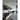 Modern kitchen with sleek grey cabinets, white countertop, and LED under-cabinet lighting