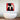 Abstract red, black, and white wall art above modern freestanding bathtub in luxury bathroom