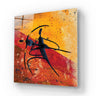 Abstract glass art panel with bold black figure on fiery red and gold background, ideal for modern interiors.
