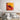 Abstract art canvas with bold red and gold hues, featuring dynamic black figure, displayed above modern bed.