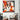 Geometric dog art print in vibrant orange, white, and gray, displayed in modern living room with houndstooth chair