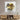 Abstract gold and silver glass art print on modern living room wall above wooden media console