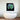 Abstract green and grey sculptural artwork above modern bathtub in luxury bathroom