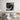 Black and white pixelated wall art above modern bed in minimalist bedroom