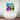 Vibrant abstract art with piano keys and saxophone above modern bathtub, decorative glass wall feature