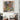 Abstract wall art with geometric patterns, gold frames, and palm leaves in modern living room