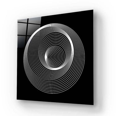 Black and white spiral pattern on decorative glass panel, modern architectural design