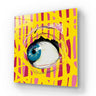 Vibrant blue eye art on yellow and pink geometric glass panel, modern decorative wall feature