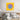 Vibrant yellow wall art with blue skull and purple cat, modern bedroom decor