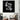 Black and white floral wall art above modern armchair in stylish living room