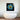 Bespoke decorative glass artwork with blue and yellow abstract design above modern bathtub