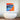 Vibrant shark art print above modern bathtub in luxury bathroom, featuring bold blue and orange colors