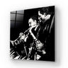 Black and white glass art panel featuring jazz musicians with trumpet and saxophone, ideal for modern interiors.