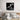 Black and white jazz musicians wall art above modern bed in minimalist bedroom