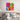 Colorful 'LOVE' wall art above bed in modern bedroom