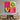 Colorful 'LOVE' wall art with bold typography, modern decor above wooden console table