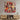 Vibrant musical instruments artwork on glass wall panel above wooden media console