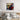 Pop art superhero wall art with bold colors and speech bubble, styled above modern bed in bedroom
