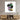 Modern abstract art print of classical sculpture with colorful paint strokes, displayed above wooden media console
