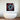 Bespoke decorative glass artwork with red and blue abstract design above modern bathtub