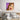 Pop art wall art with surprised woman, bold colors, above modern bed in bedroom