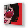 Pop art glass wall art with bold red and black design, featuring stylized woman's face and sunglasses