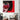 Pop art wall art featuring bold red and black graphic portrait with halftone details, styled in modern living room