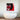Pop art wall art with bold red and black design above modern bathtub in luxury bathroom