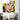 Pop art woman portrait with speech bubble, bold yellow hair, red lips, displayed in modern living room