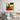 Abstract geometric wall art with bold red, yellow, green shapes above modern bed in minimalist bedroom