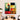 Abstract geometric wall art with bold red, green, yellow, and black shapes in modern dining room