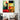 Abstract geometric wall art with bold red, yellow, green, and black shapes in modern living room