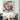 Abstract geometric bird artwork on wall above modern armchair in stylish living room