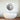 Modern bathroom with freestanding tub and abstract circular wall art