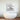 Modern white freestanding bathtub with abstract 3D wall art in luxury bathroom