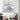 Abstract white 3D wall art in modern living room with houndstooth armchair and minimalist decor