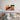 Abstract wall art with colorful geometric patterns above modern bed in minimalist bedroom