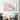 Abstract pastel 3D sphere wall art in modern living room with houndstooth chair