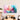 Abstract pastel glass wall art with flowing pink, blue, and yellow hues in modern dining room