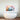 Abstract pastel art print above modern freestanding bathtub in luxury bathroom
