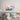 Pastel abstract wall art above modern bed in minimalist bedroom decor