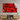Vibrant red abstract glass wall art above modern wooden console in luxury interior