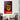 Vibrant horror movie poster art with bold yellow and red design, displayed in modern living room