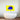 Vibrant yellow decorative glass art with bold blue lips, modern bathroom feature mirror above freestanding tub