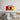Pop art wall art with 'BLA BLA BLA' speech bubble above bed in modern bedroom