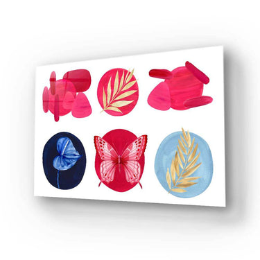 Bespoke decorative glass art with butterfly and leaf motifs in vibrant red, blue, and gold tones